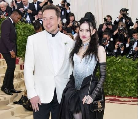 Elon Musk and his girlfriend Grimes at an event